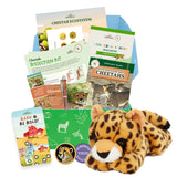 A collection of items including a cheetah plush toy, books, and educational materials related to cheetahs and their ecosystem.