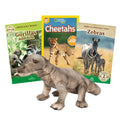 Three children's books about gorillas, cheetahs, and zebras with a toy Komodo Dragon in front on a white background