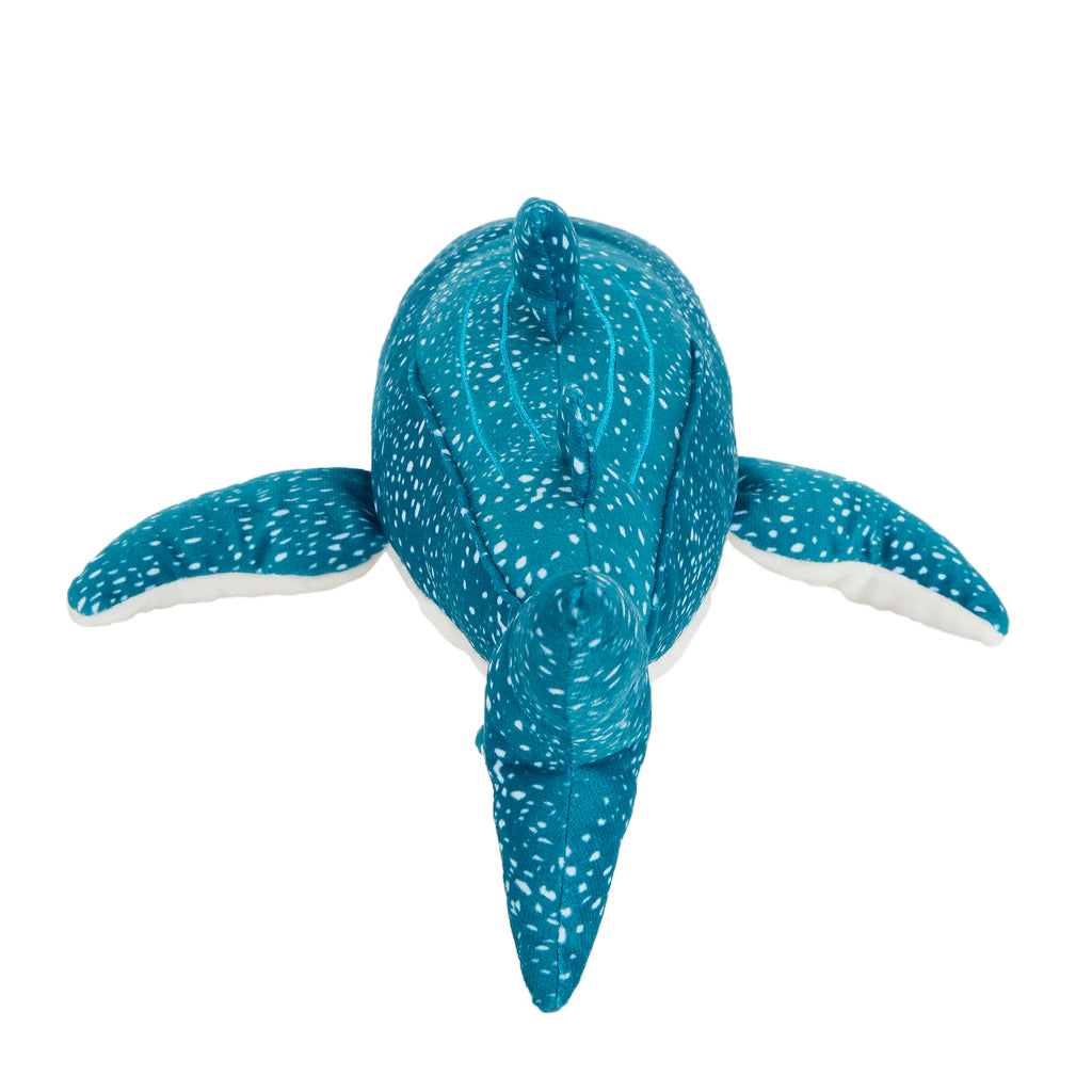 Blue plush whale toy on a white background