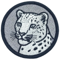 Embroidered patch of a leopard's head on a gray background