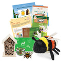 Educational bee-themed items including a plush bee, insect house, and books on a white background
