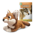 Plush Ethiopian wolf toy next to a book titled 'Wolves' on a white background