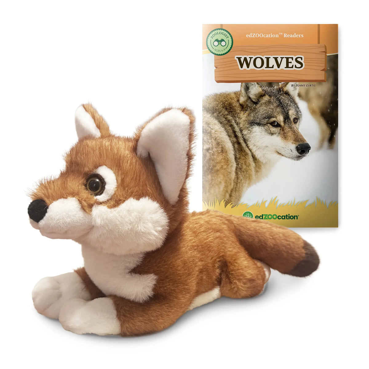 Plush Ethiopian wolf toy next to a book titled 'Wolves' on a white background