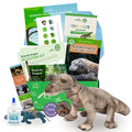 Assorted children's educational toys and books related to Komodo Dragons, including a stuffed animal, a craft item, a fact card, a bookmark, a writing prompt, a magazine, and a surprise item, all themed around zoology.