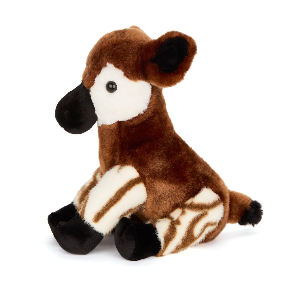 Plush toy okapi with brown, white, and black coloring on a white background