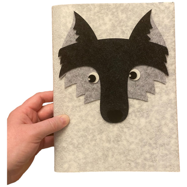 Wolf Felt composition notebook showcasing a wolf's face