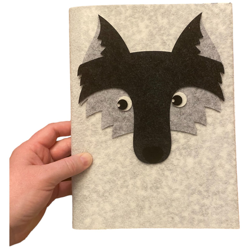 Wolf Felt composition notebook showcasing a wolf's face
