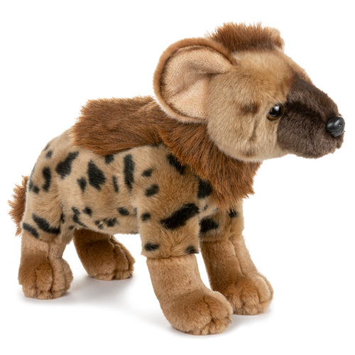 A plush toy representing a hyena, featuring a brown and beige color scheme with black spots, standing upright.